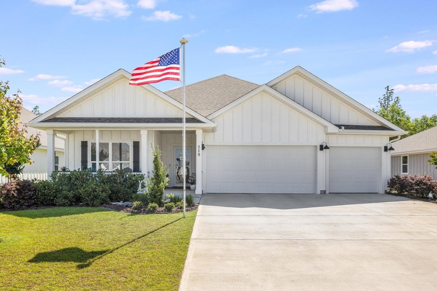 519 Mary Lou Way Crestview, FL 32539 - Photo 1 of 53 a view of a white house with a yard and potted plants