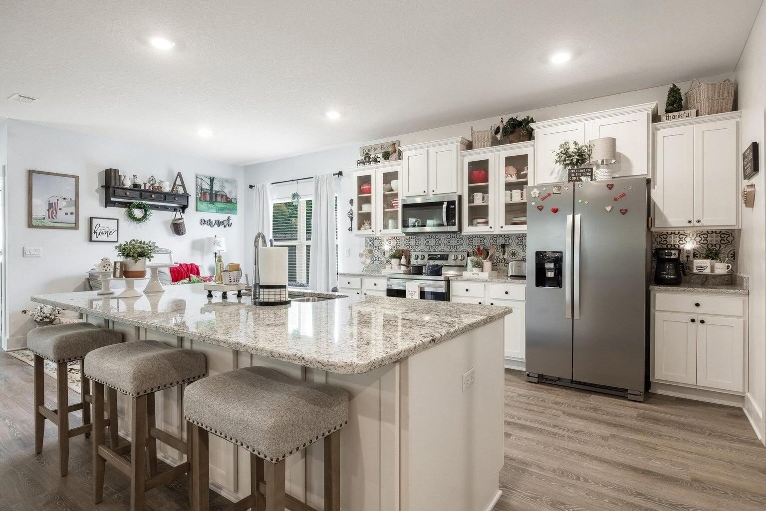 519 Mary Lou Way Crestview, FL 32539 - Photo 16 of 53 a kitchen with refrigerator and cabinets