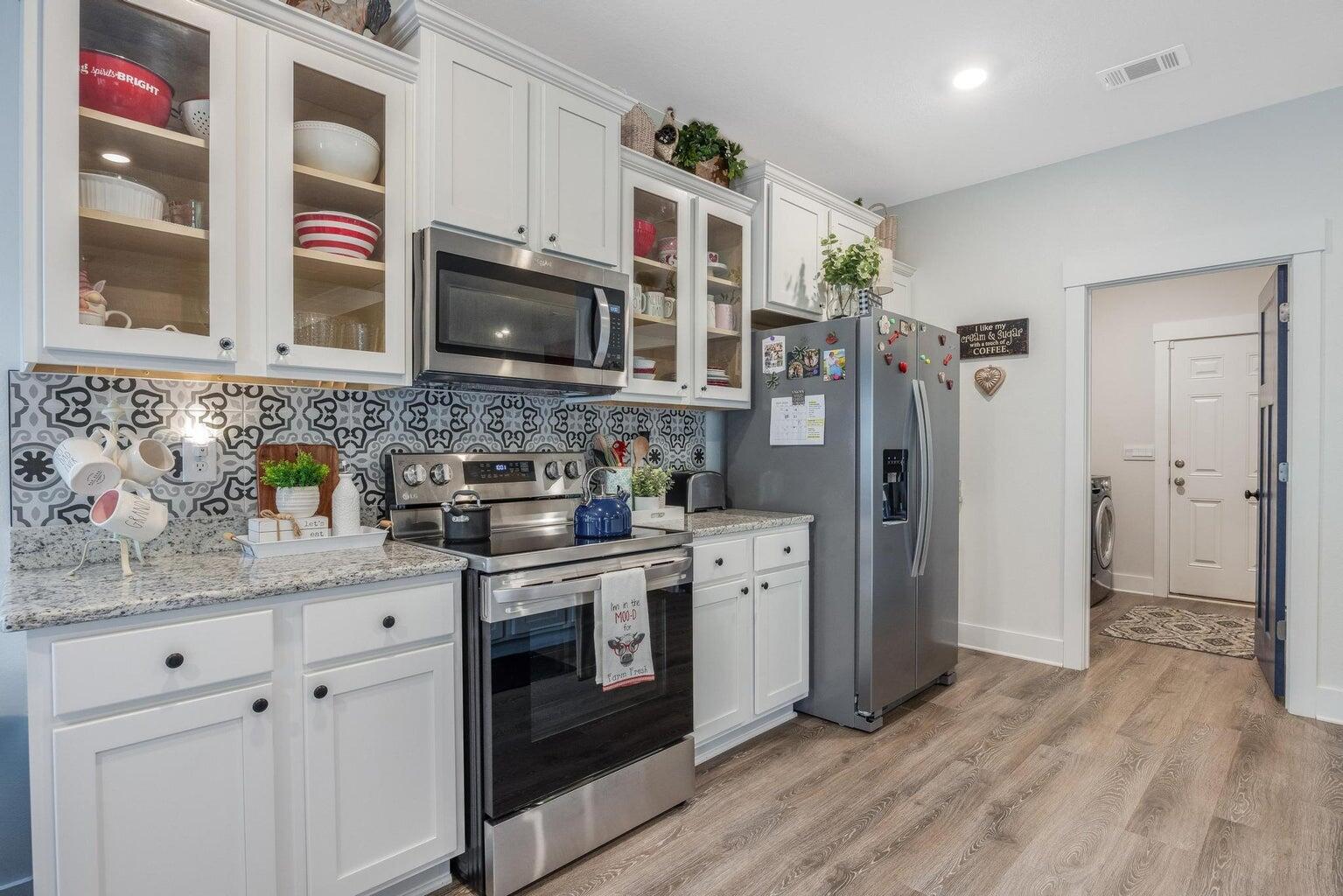 519 Mary Lou Way Crestview, FL 32539 - Photo 22 of 53 a kitchen with stainless steel appliances granite countertop a stove and a sink