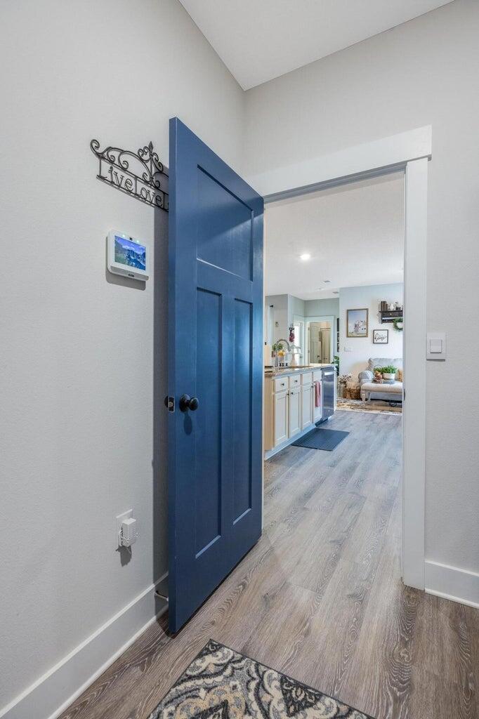 519 Mary Lou Way Crestview, FL 32539 - Photo 25 of 53 a view of a hallway with wooden floor and windows