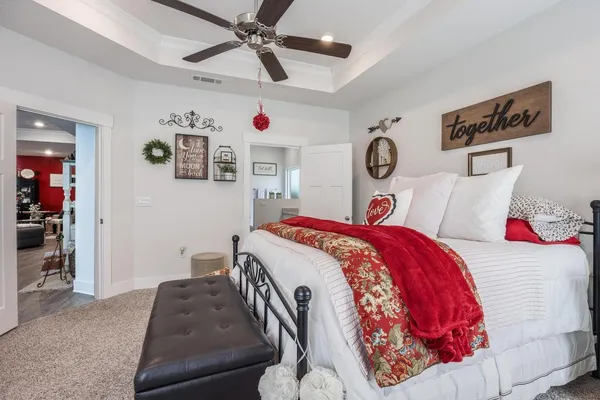 a bathroom with a granite countertop double vanity sink and a mirror