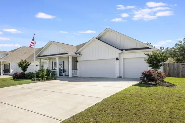 a room with furniture and flower pot