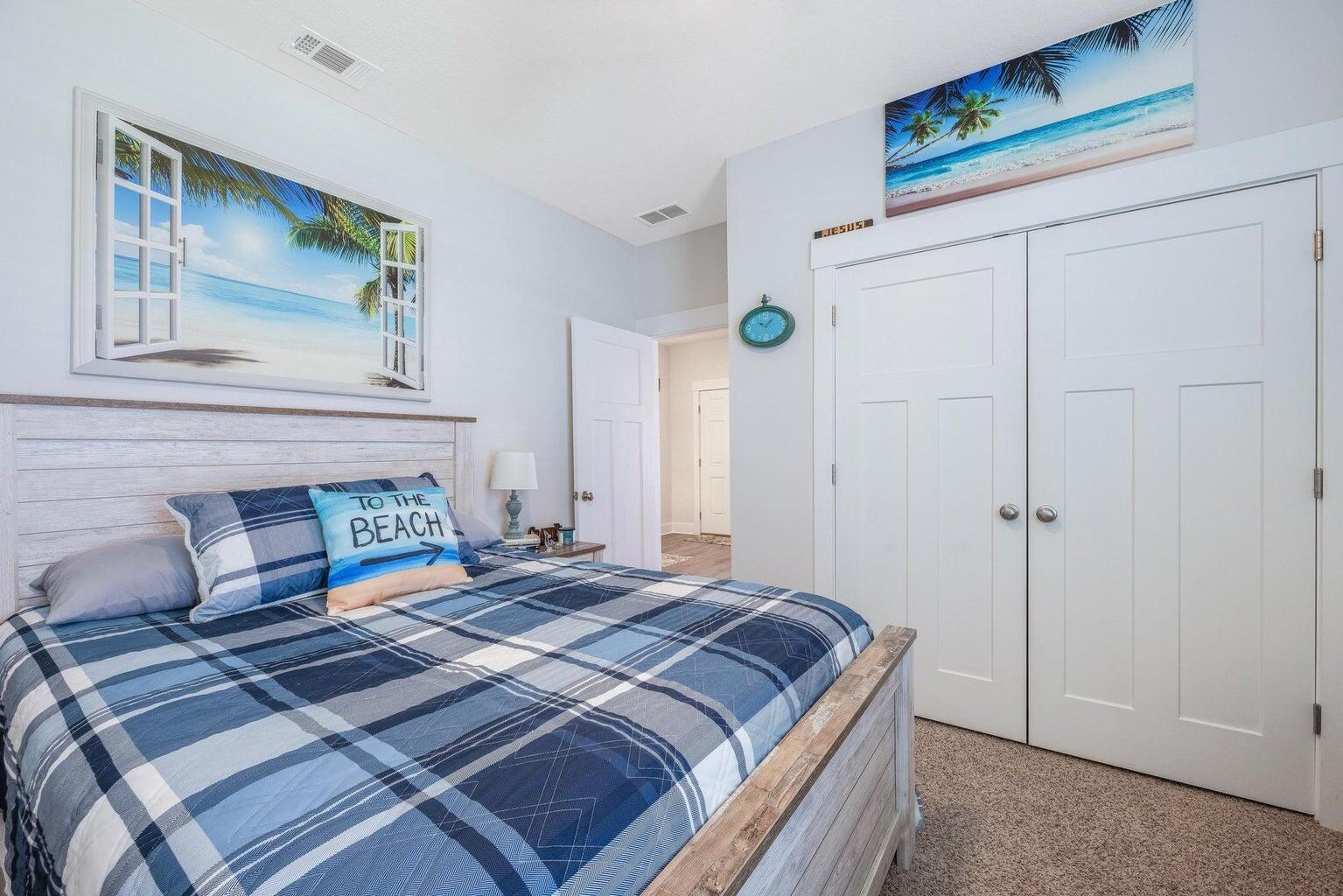 519 Mary Lou Way Crestview, FL 32539 - Photo 34 of 53 a bedroom with a bed and a painting on the wall