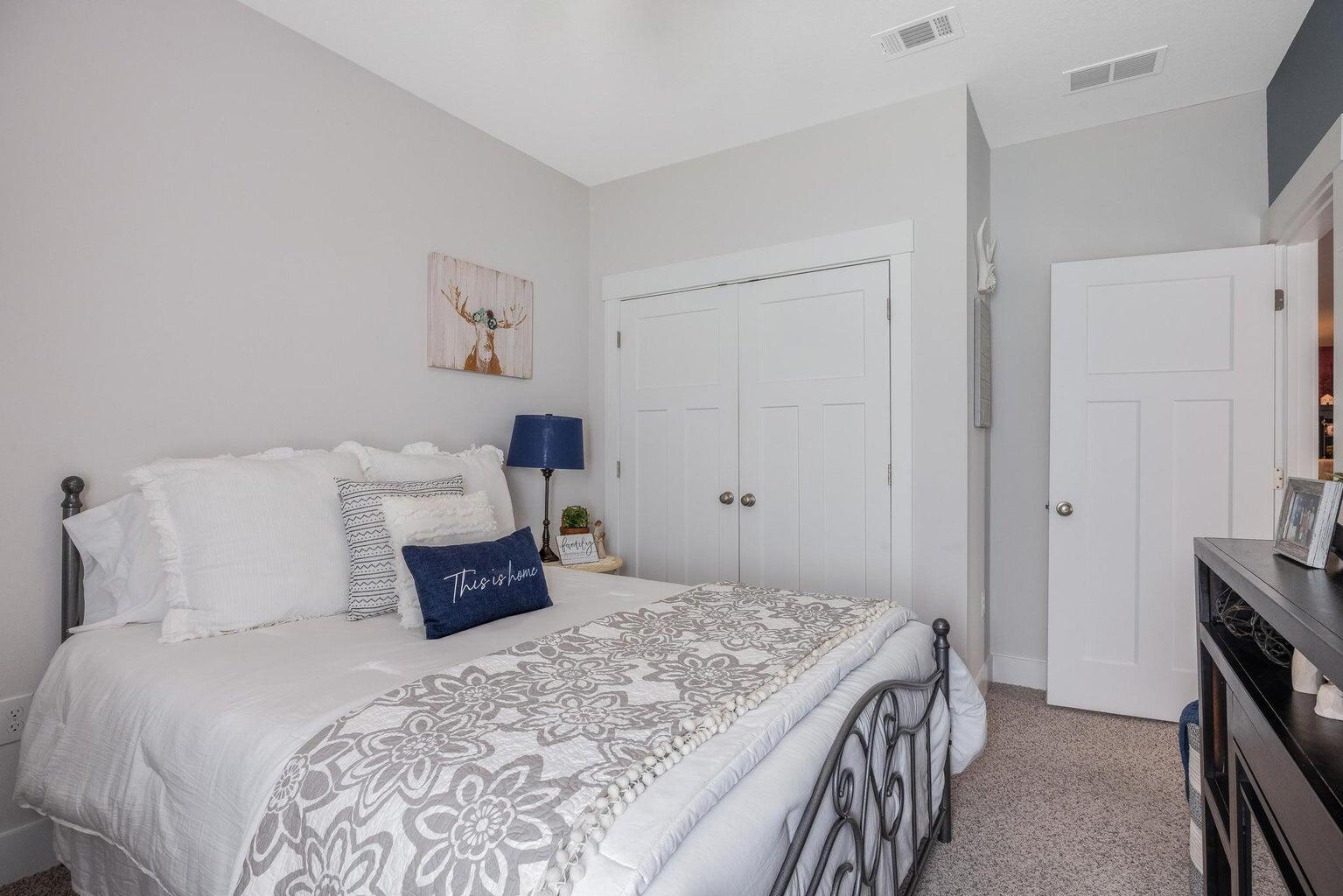 519 Mary Lou Way Crestview, FL 32539 - Photo 37 of 53 a bedroom with a bed and a tv on the dresser