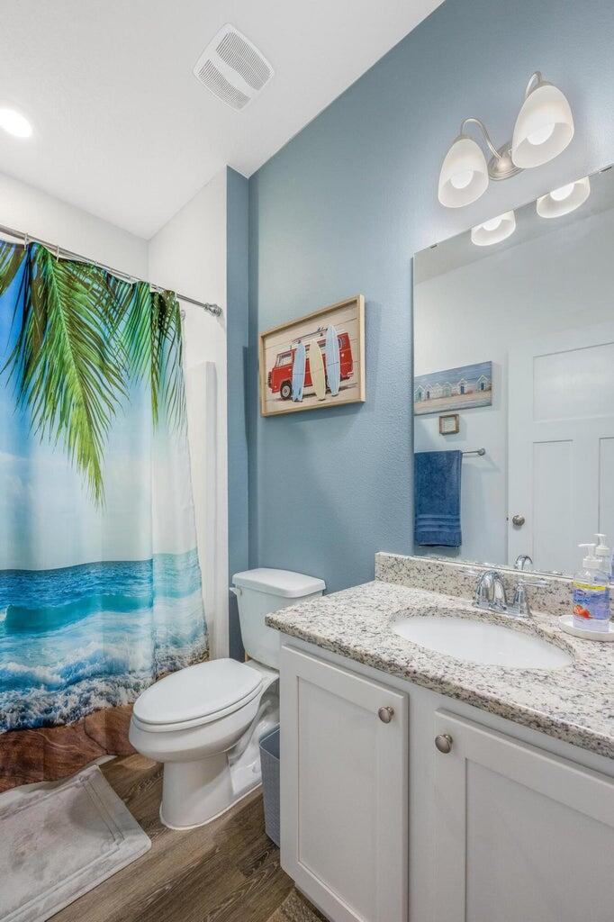 519 Mary Lou Way Crestview, FL 32539 - Photo 40 of 53 a bathroom with a granite countertop sink a toilet and a mirror