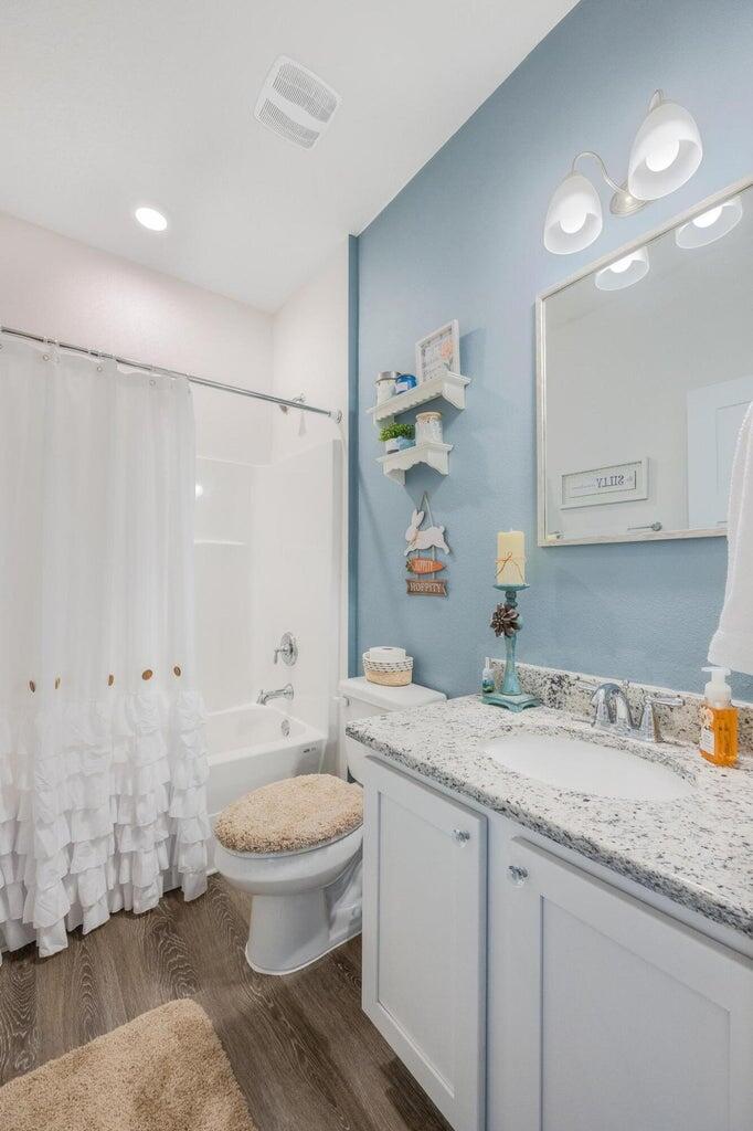 519 Mary Lou Way Crestview, FL 32539 - Photo 42 of 53 a bathroom with a granite countertop sink a toilet a mirror and shower