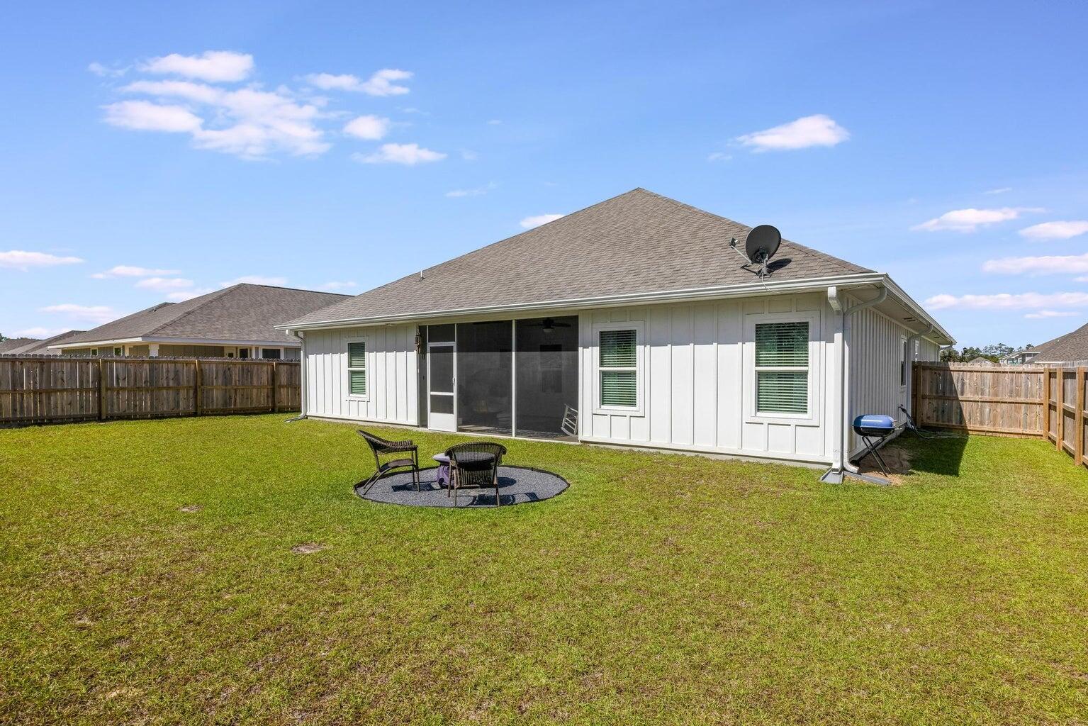 519 Mary Lou Way Crestview, FL 32539 - Photo 48 of 53 a front view of a house with a garden and porch