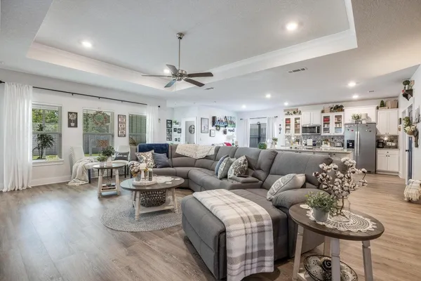 a living room with furniture and a large window