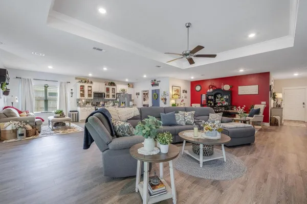a view of a dining room with furniture and wooden floor