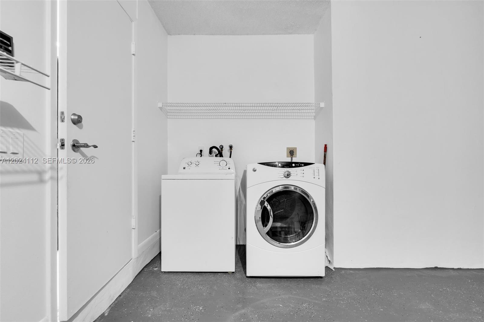 4366 Mahogany Ridge Drive Weston, FL 33331 - Photo 21 of 41 a utility room with dryer and washer