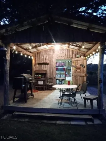 a view of a yard with an outdoor space