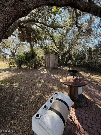 a view of a field with an outdoor space