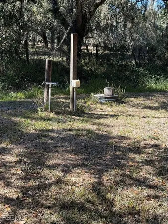 a view of a house with swimming pool and sitting area