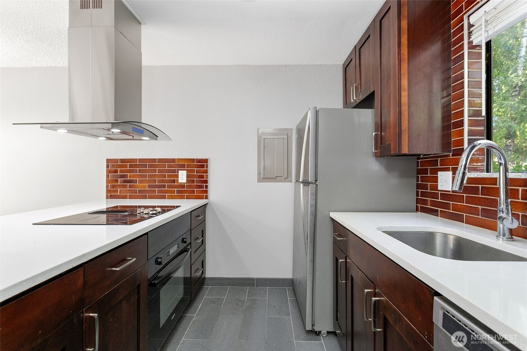 1802 Maple Lane, Unit A5 Kent, WA 98030 - Photo 7 of 27 a kitchen with stainless steel appliances granite countertop a sink stove and refrigerator