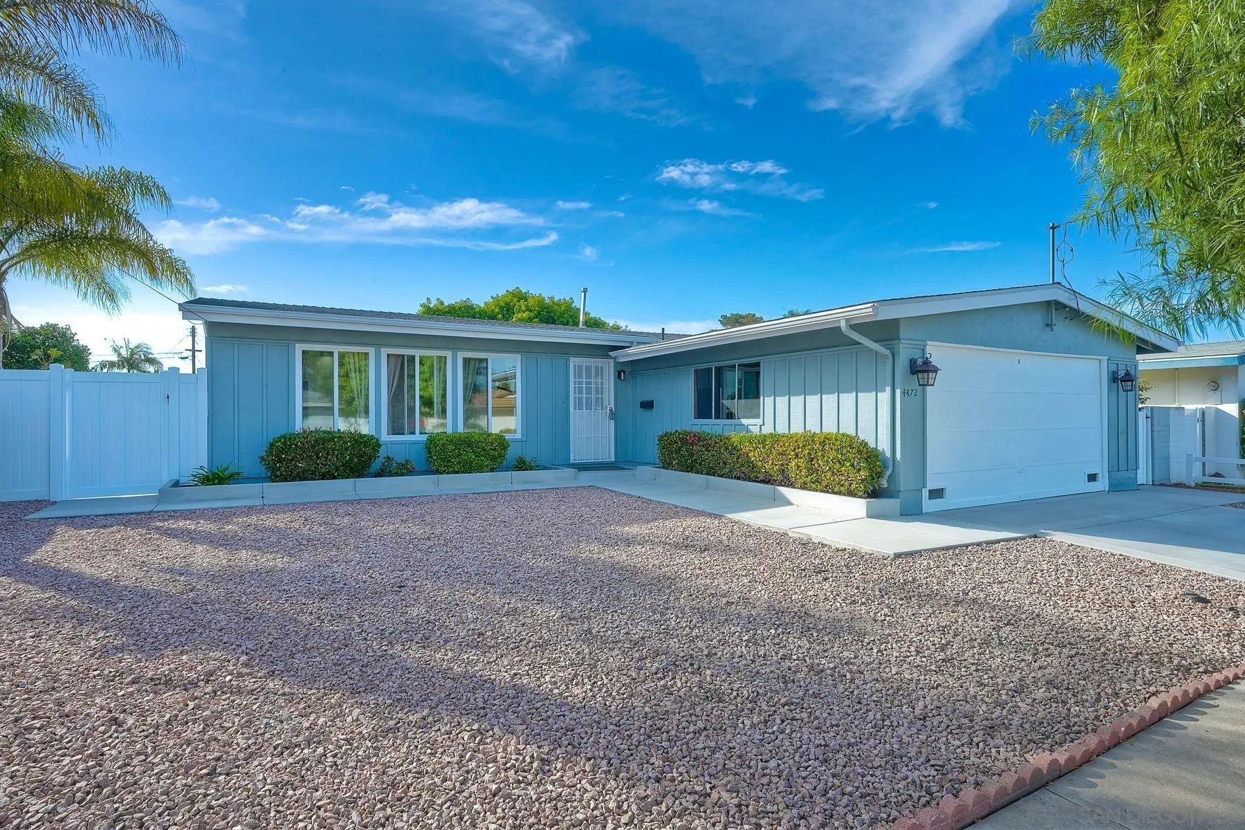 4472 Rolfe Road San Diego, CA 92117 - Photo 3 of 23 a view of a house with a yard and potted plants