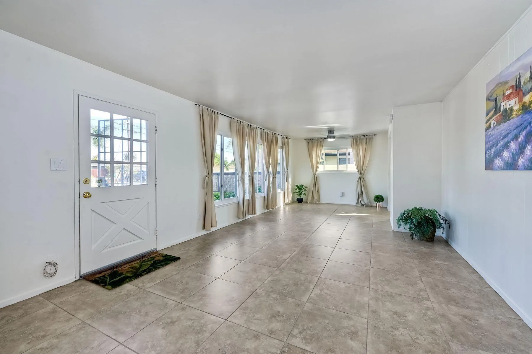 4472 Rolfe Road San Diego, CA 92117 - Photo 5 of 23 a view of an empty room with a window