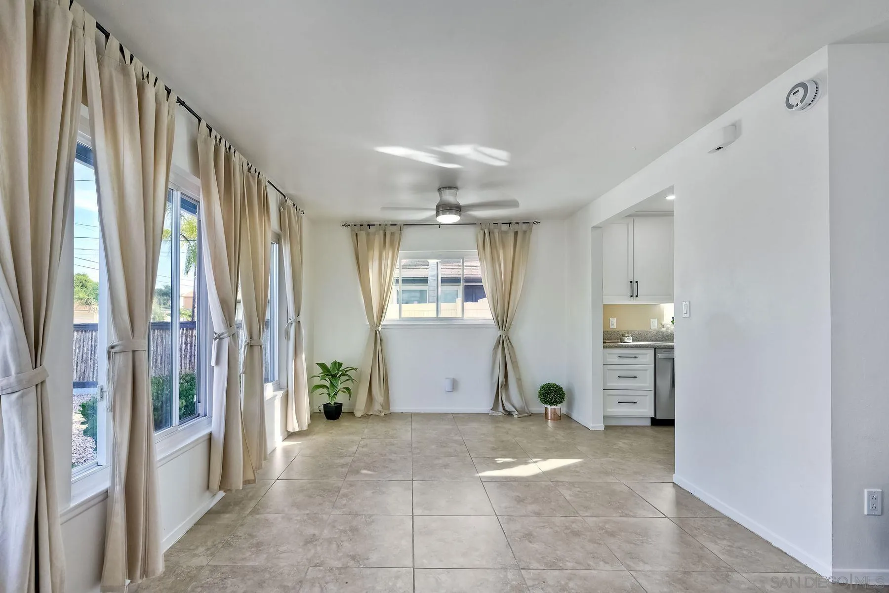 4472 Rolfe Road San Diego, CA 92117 - Photo 6 of 23 a view of a hallway with windows and entryway