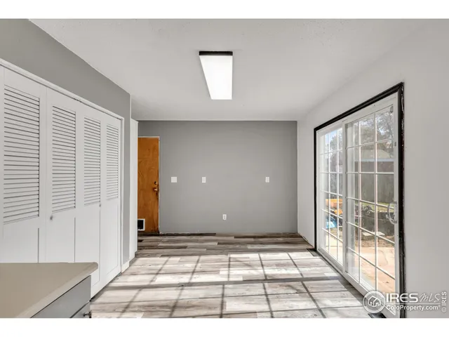 a view of an empty room with windows