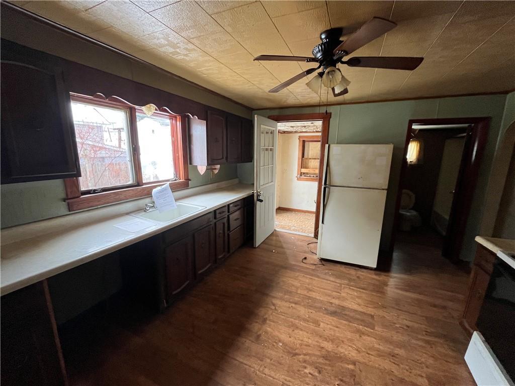 539 5th Street Colver, PA 15927 - Photo 5 of 13 a open kitchen with stainless steel appliances granite countertop a refrigerator a sink and a stove