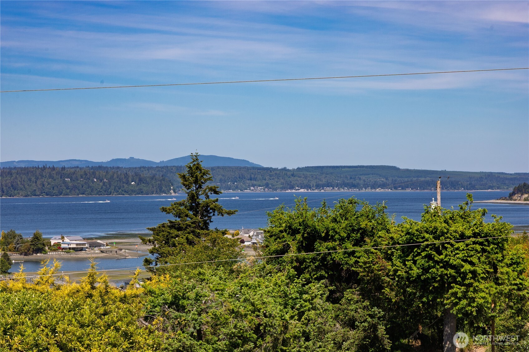 37709 Olympic View Road Northeast Hansville, WA 98340 - Photo 1 of 40 a view of a lake with a mountain in the back