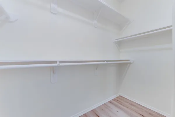 a view of an empty walk in closet