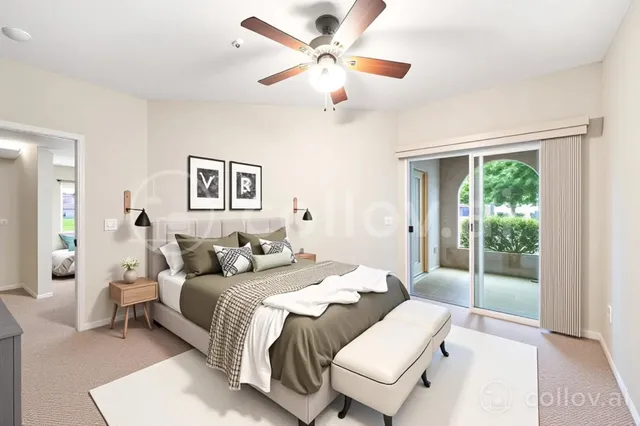 a bedroom with a bed and a large window