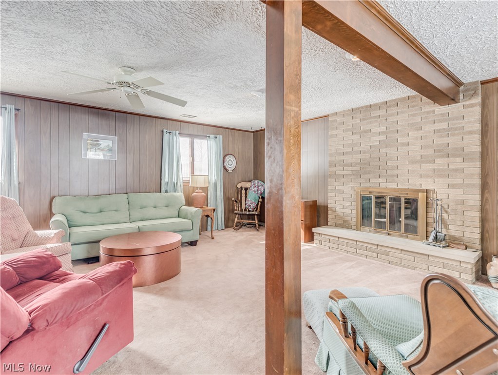 2481 Raber Road Uniontown, OH 44685 - Photo 28 of 33 Lower Level Family room with fireplace and sliding doors to the rear patio