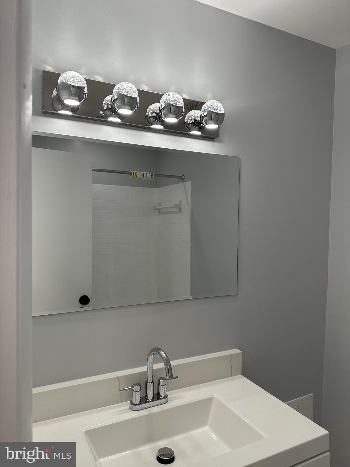 7967 Riggs Road, Unit 796710 Hyattsville, MD 20783 - Photo 11 of 11 a bathroom with a sink and cabinets