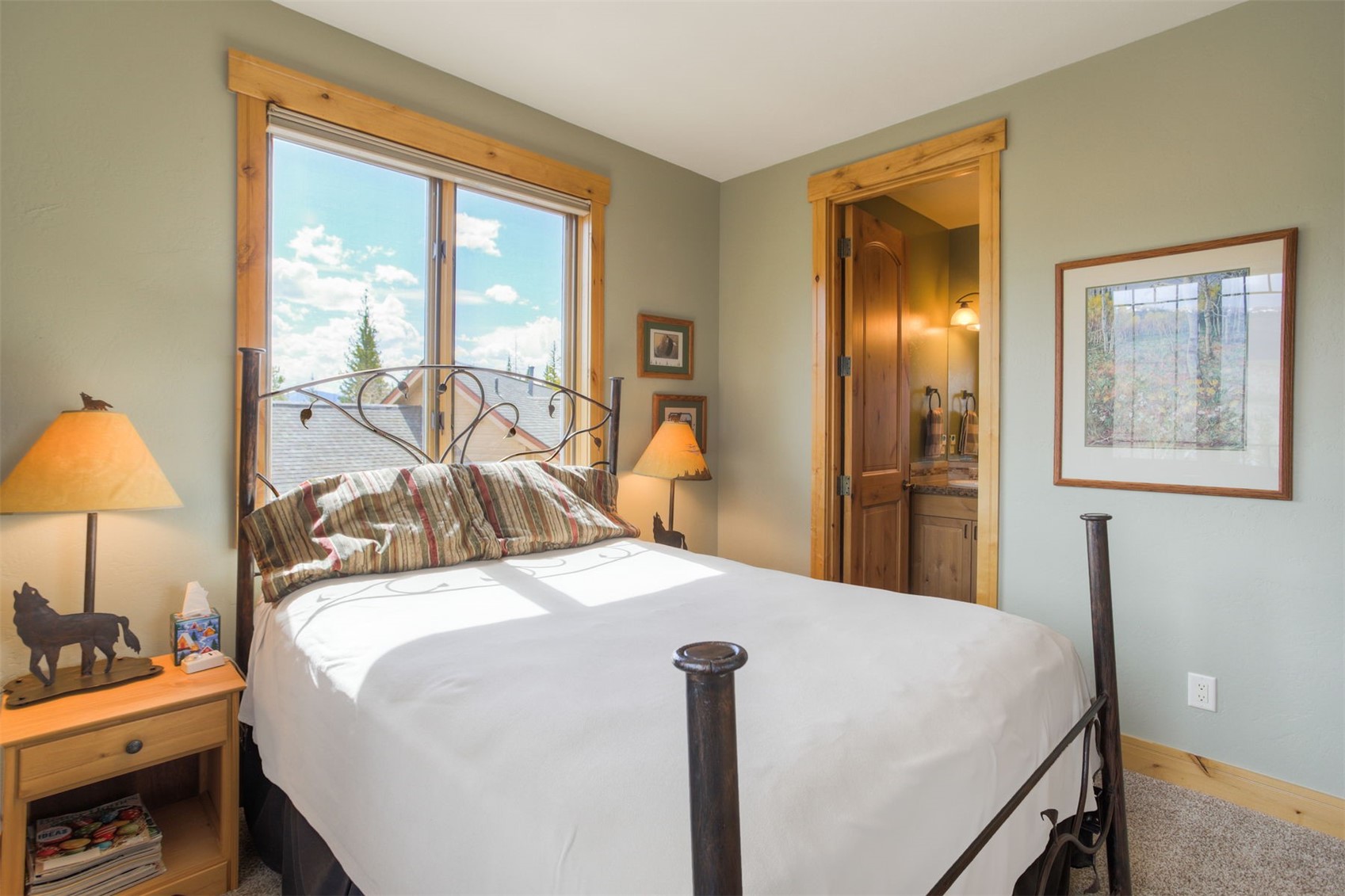 727 Willowbrook Road Silverthorne, CO 80498 - Photo 32 of 47 a bedroom with a bed and a lamp