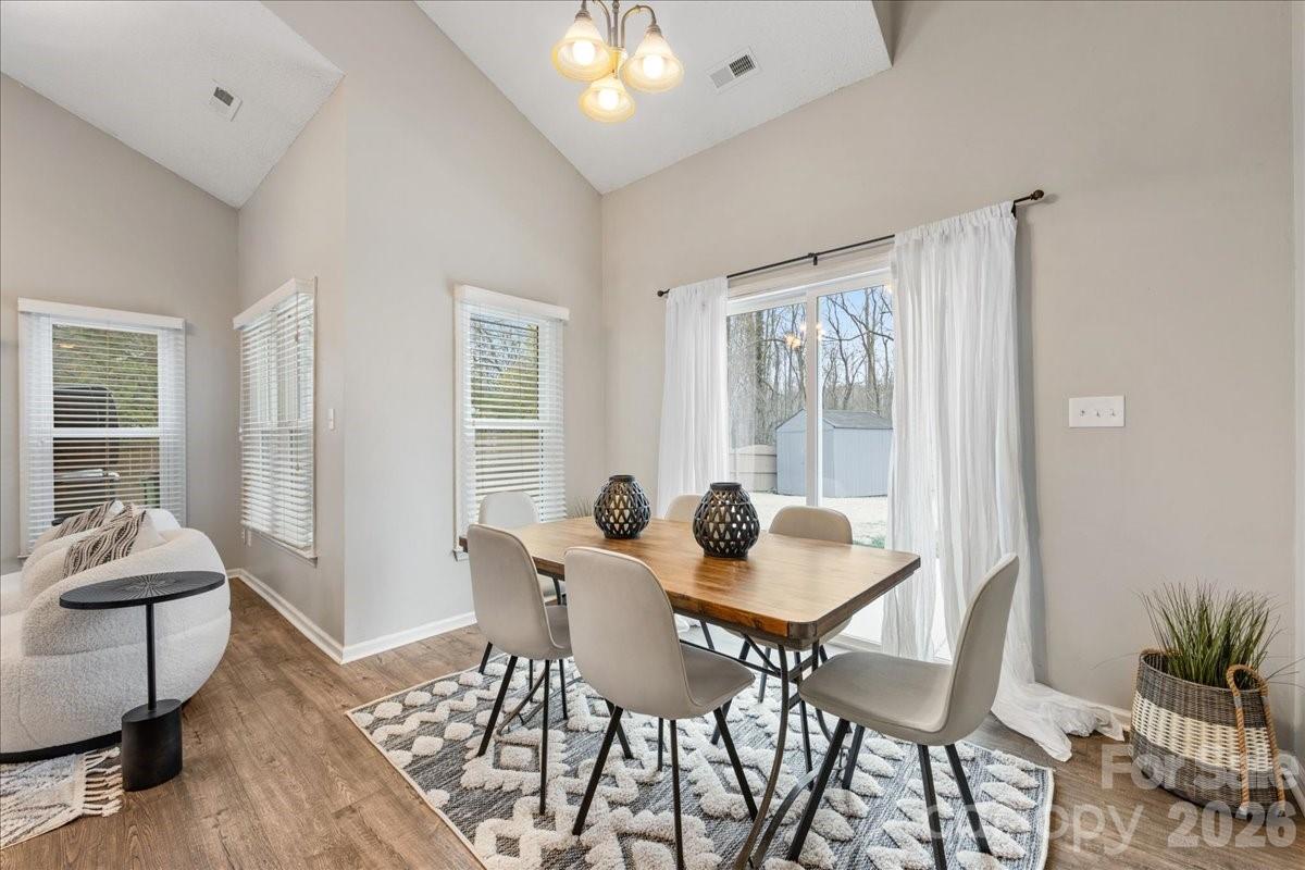7800 Trotter Road Charlotte, NC 28216 - Photo 11 of 46 a dining room with furniture and window