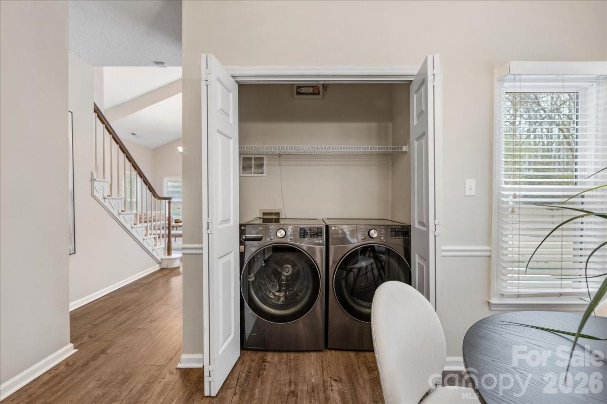 7800 Trotter Road Charlotte, NC 28216 - Photo 14 of 46 a view of livingroom with furniture wooden floor and windows