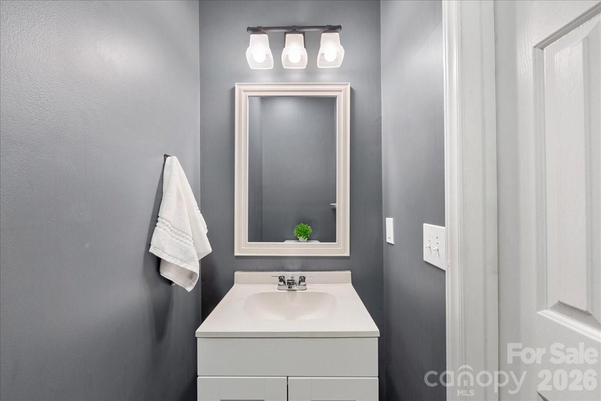 7800 Trotter Road Charlotte, NC 28216 - Photo 21 of 46 a bathroom with a sink and a window