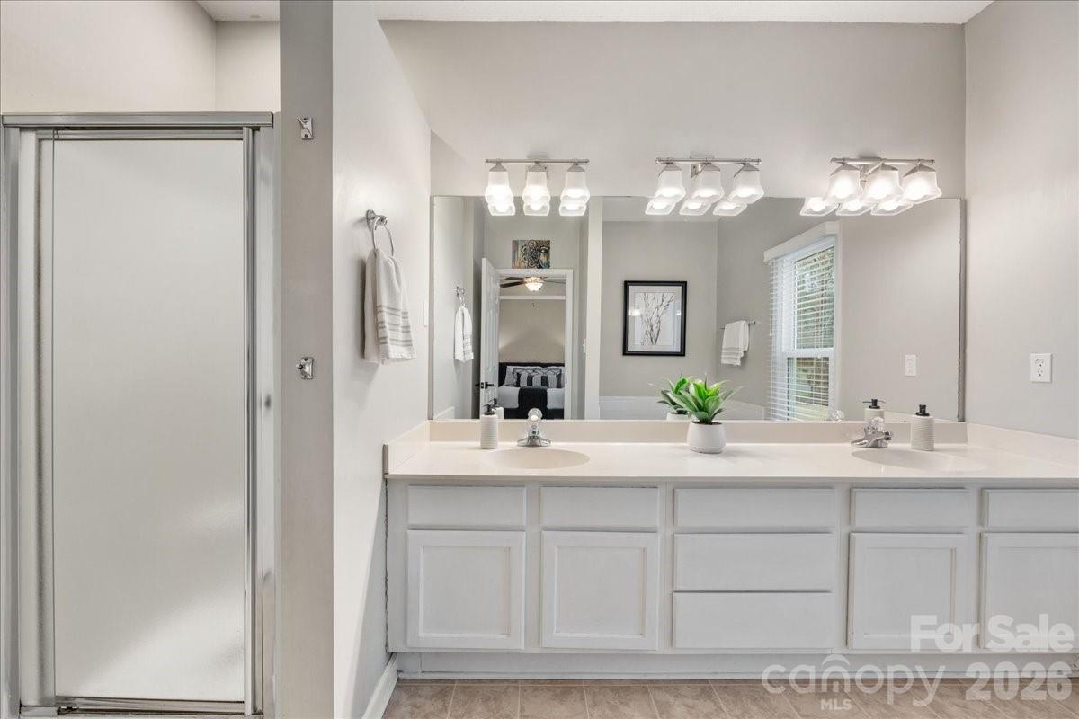 7800 Trotter Road Charlotte, NC 28216 - Photo 25 of 46 a bathroom with a sink and a mirror