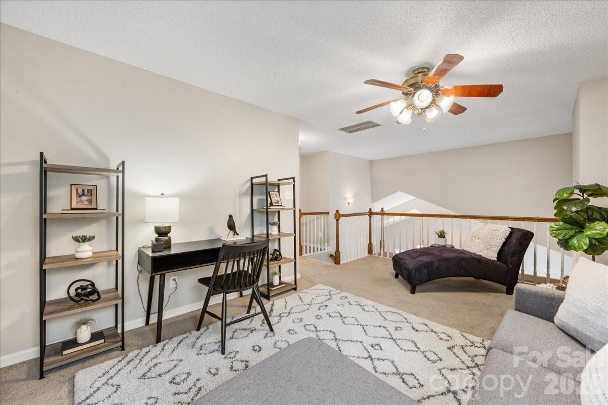 7800 Trotter Road Charlotte, NC 28216 - Photo 33 of 46 a view of a livingroom with furniture and a potted plant