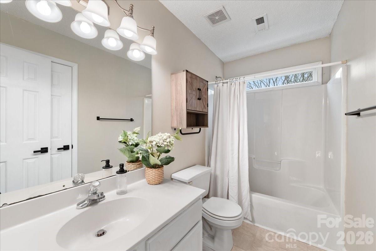 7800 Trotter Road Charlotte, NC 28216 - Photo 36 of 46 a bathroom with a sink toilet and shower