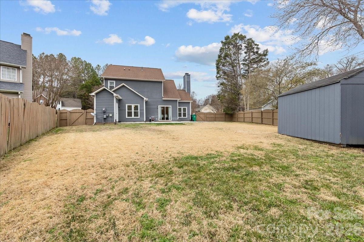 7800 Trotter Road Charlotte, NC 28216 - Photo 43 of 46 a view of a house with a yard and covered with snow