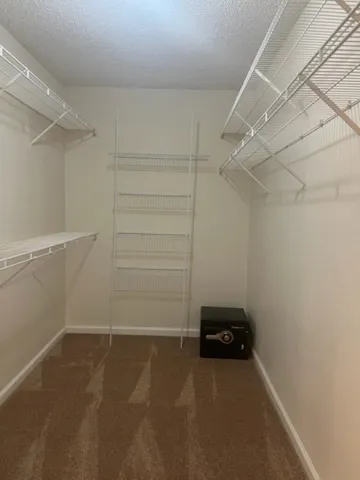 a view of a room with racks on the wall