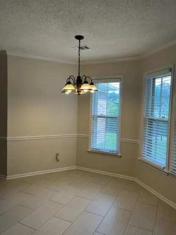 a view of a room with windows