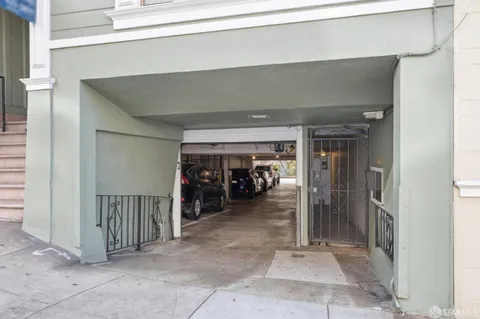 a view of a livingroom with furniture and a large window