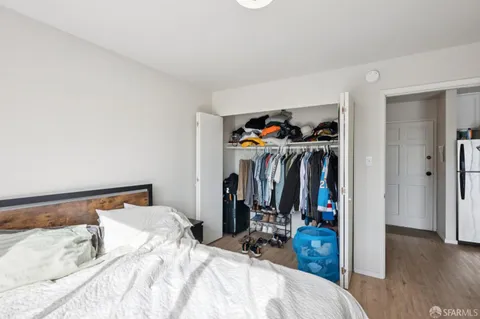 a bedroom with a bed and a closet