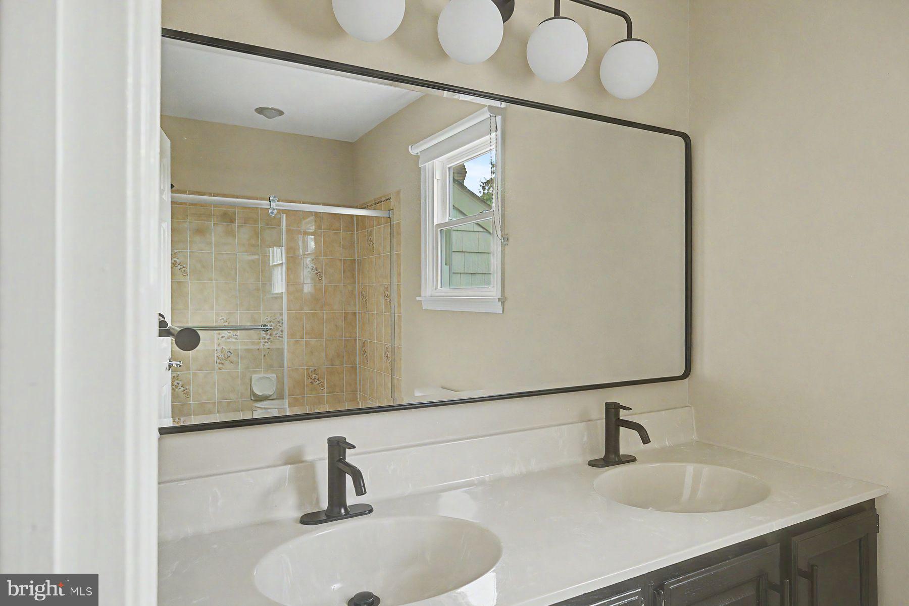 4009 Smoke Road Doylestown, PA 18902 - Photo 41 of 52 a bathroom with a sink and a mirror