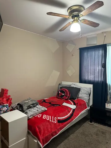 an aerial view of a house with garden space and a swimming pool