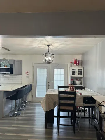 a bathroom with a double vanity sink toilet and mirror