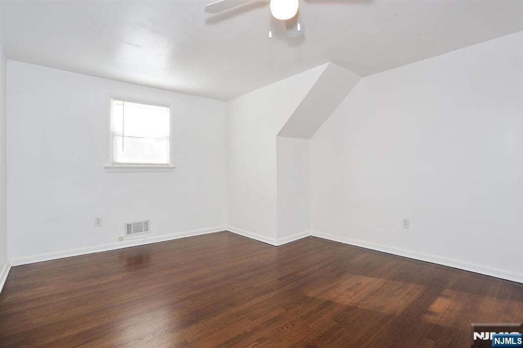 31 Madison Avenue Demarest, NJ 07627 - Photo 14 of 20 a view of an empty room with wooden floor and a window