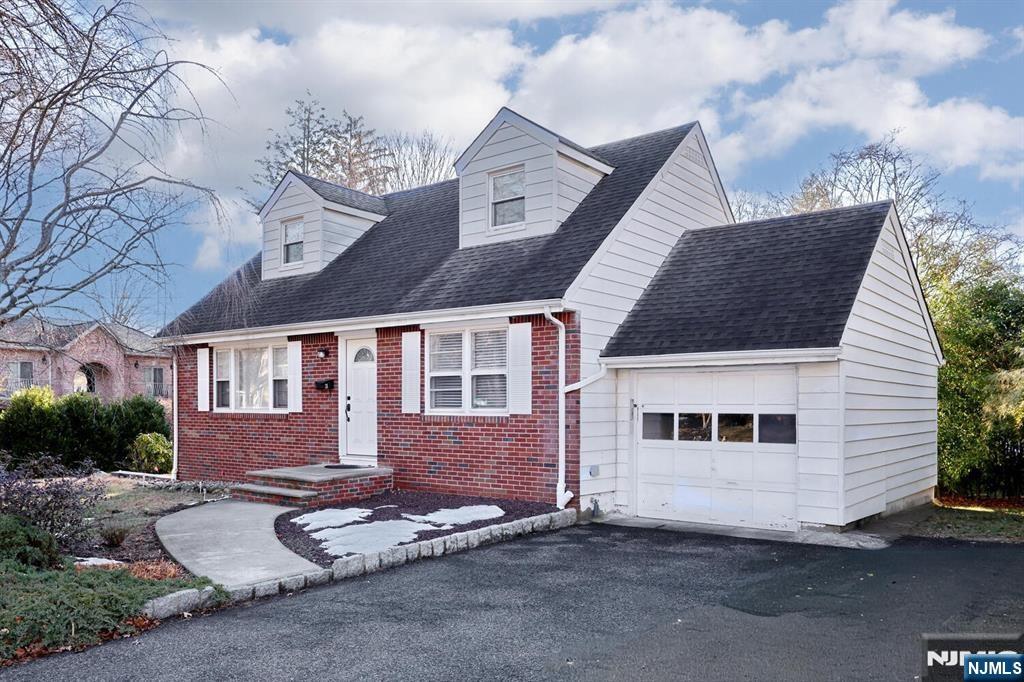 31 Madison Avenue Demarest, NJ 07627 - Photo 16 of 20 a front view of a house with a yard