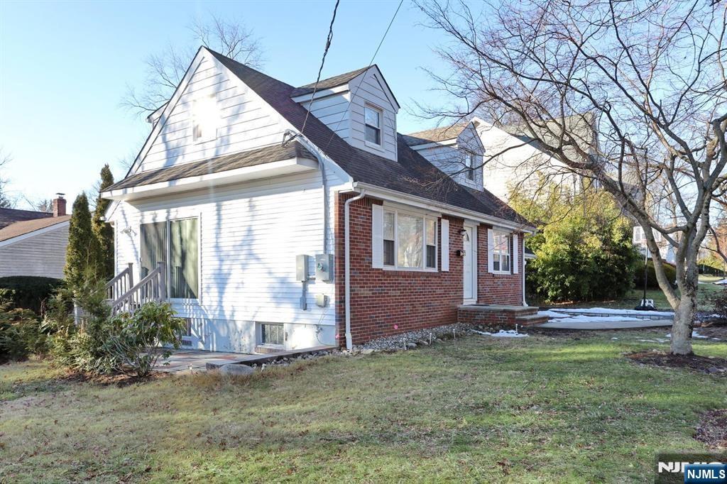 31 Madison Avenue Demarest, NJ 07627 - Photo 19 of 20 a front view of house with yard and green space