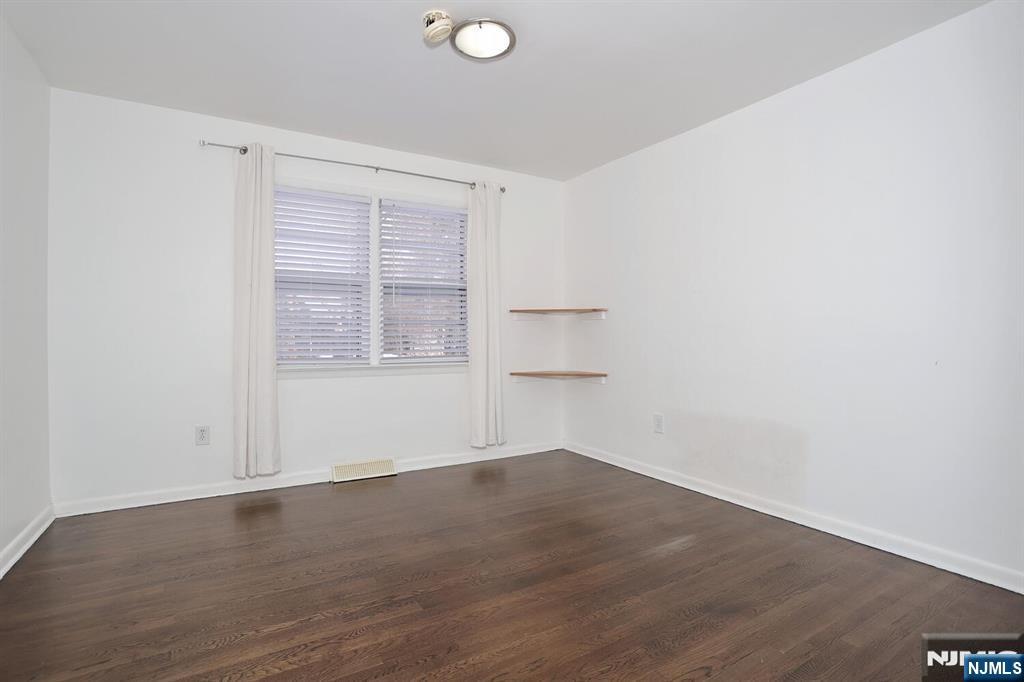 31 Madison Avenue Demarest, NJ 07627 - Photo 8 of 20 an empty room with wooden floor and windows
