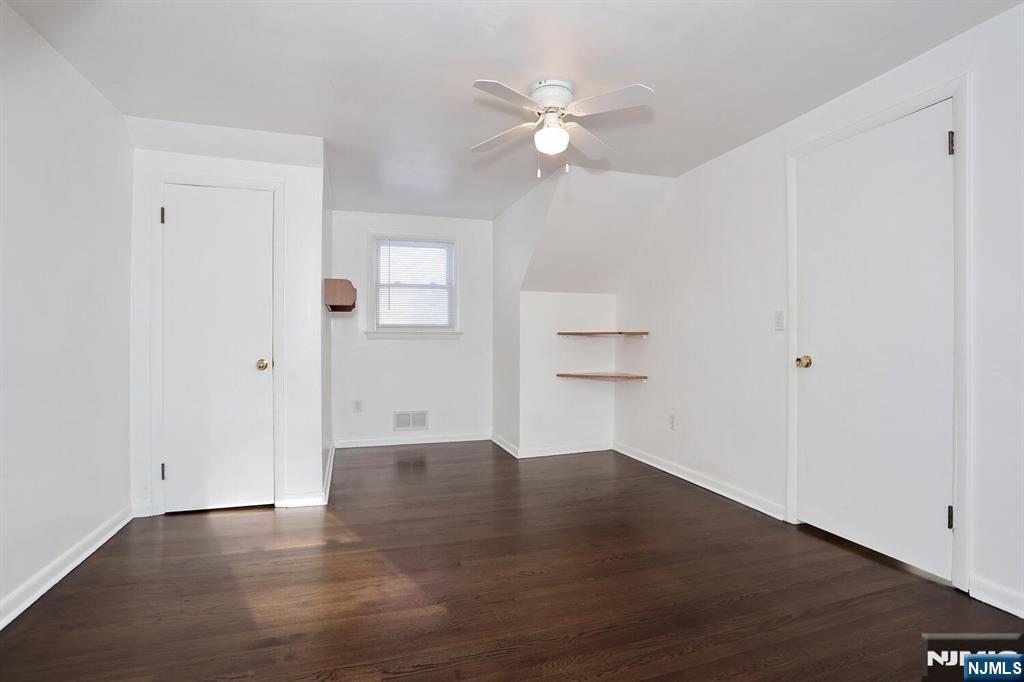 31 Madison Avenue Demarest, NJ 07627 - Photo 9 of 20 an empty room with an entryway and chandelier fan