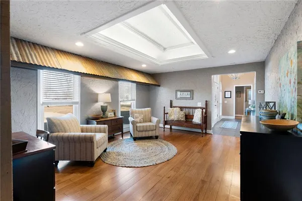a view of a dining room with furniture and wooden floor