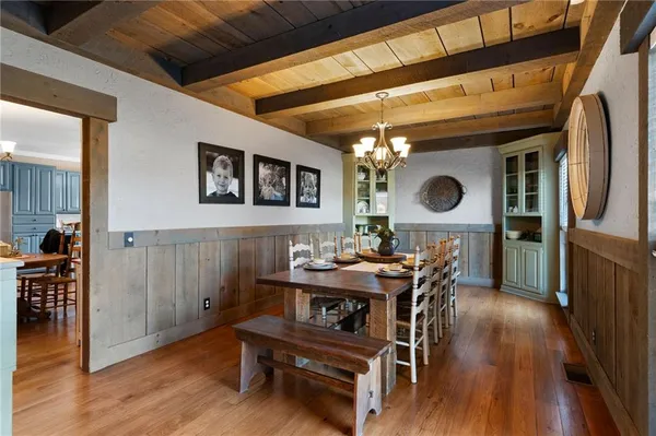 a kitchen with stainless steel appliances granite countertop wooden cabinets a sink and a stove